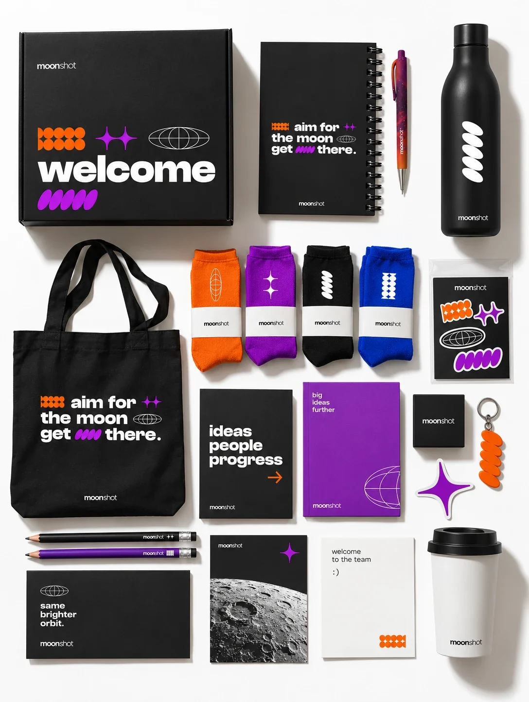 Moonshot company welcome kit: box, tote, notebooks, bottle, socks, stickers and cup